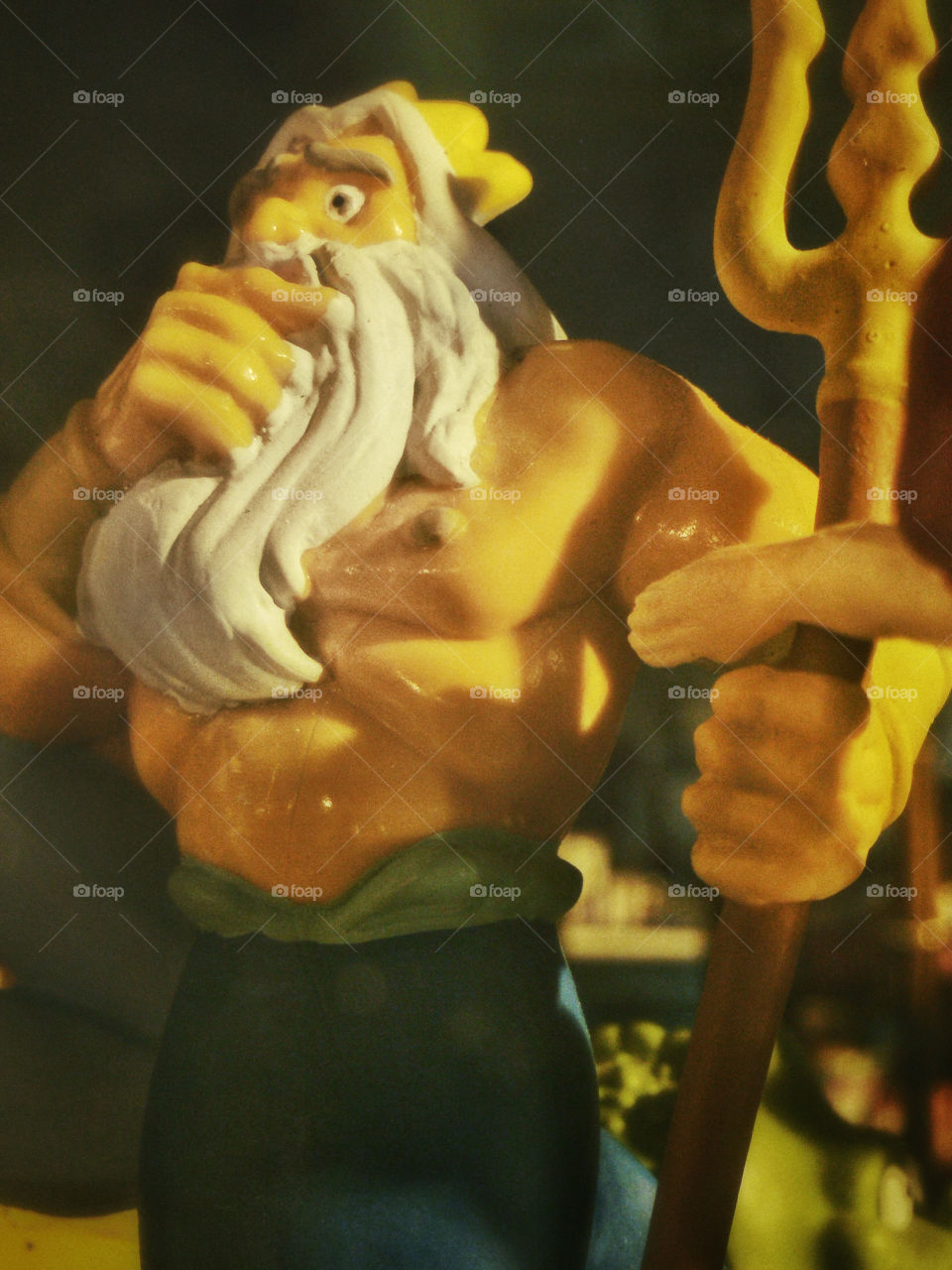 Triton on for Size | A Disney Little Mermaid King Triton figurine, probably from the 90s.