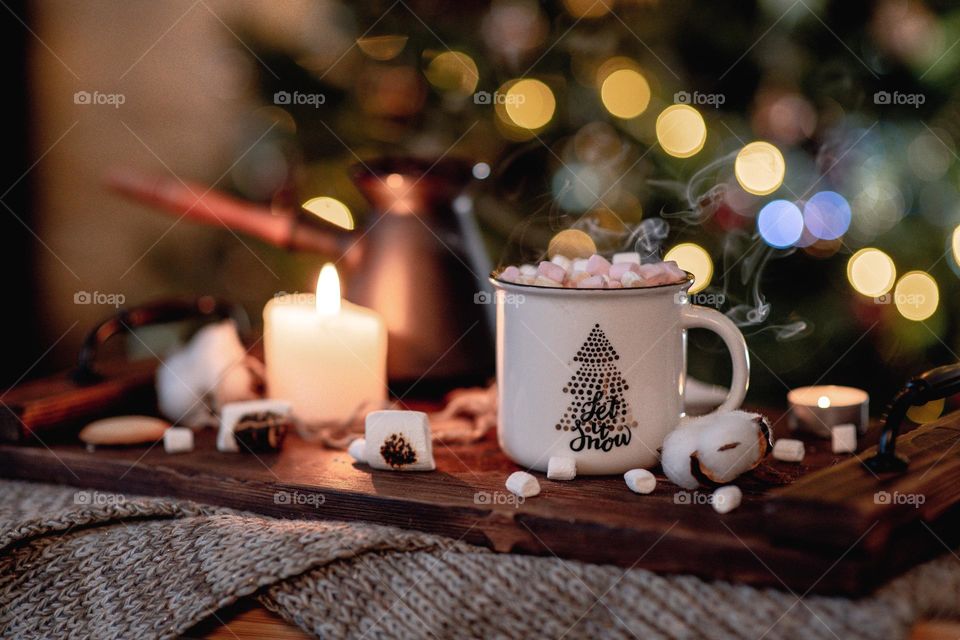 Freshly brewed coffee in white mug. Christmas mood. Hot beverages.  Hot chocolate with marshmallow