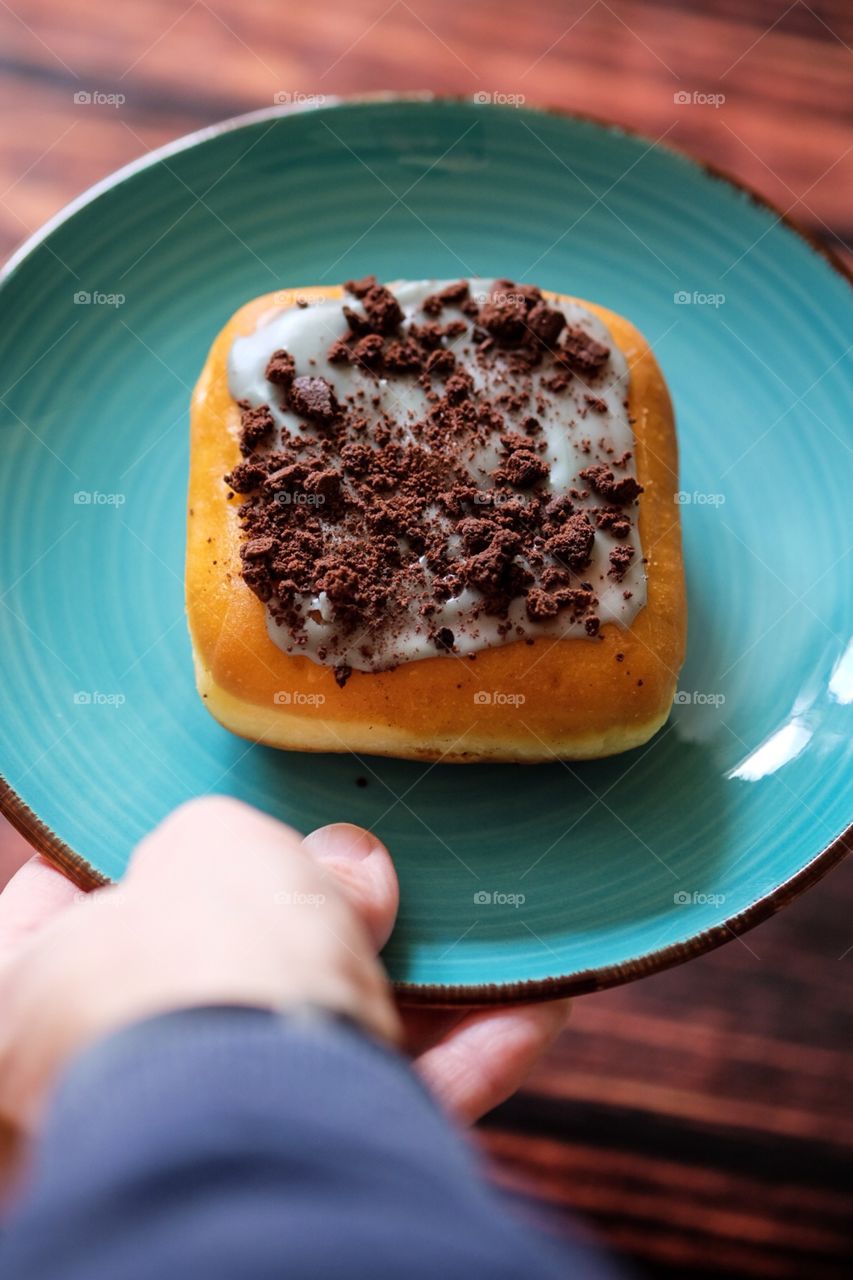 Mint Brownie Dunkin’ Donut Cream Filled St. Patrick’s Day Specialty Donut Served On A Plate