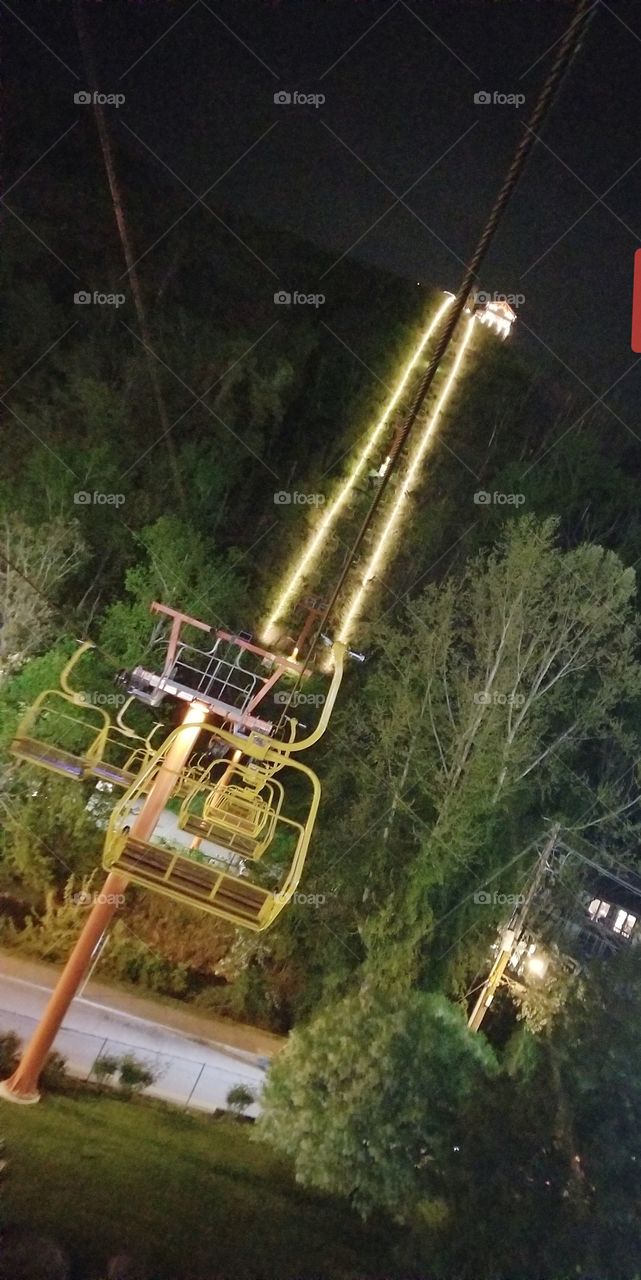 Magnificently steep ride lane for iconic Gatlinburg chair lift, downtown fun at night.