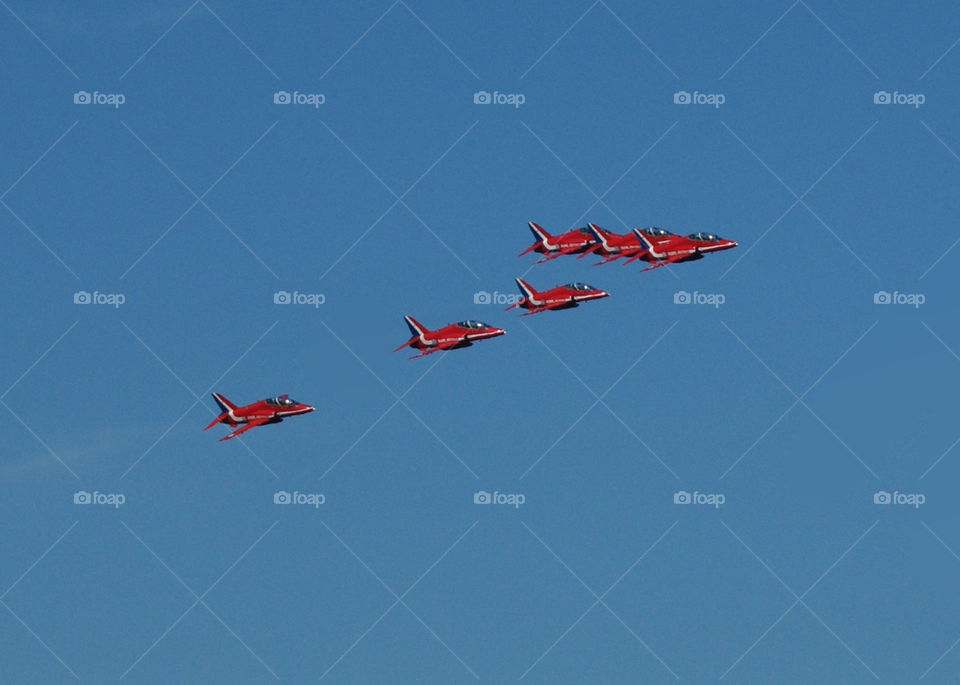 red flying plane arrows by diversion