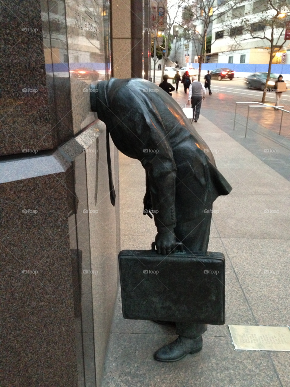 statue briefcase business person head in the wall by paul.reilly546