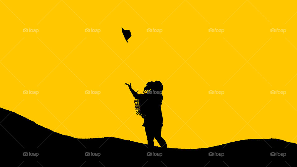 Lady throwing har in the air in colorful background