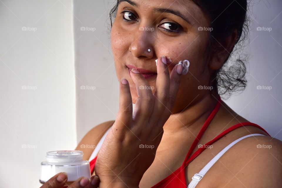 Woman applying cream