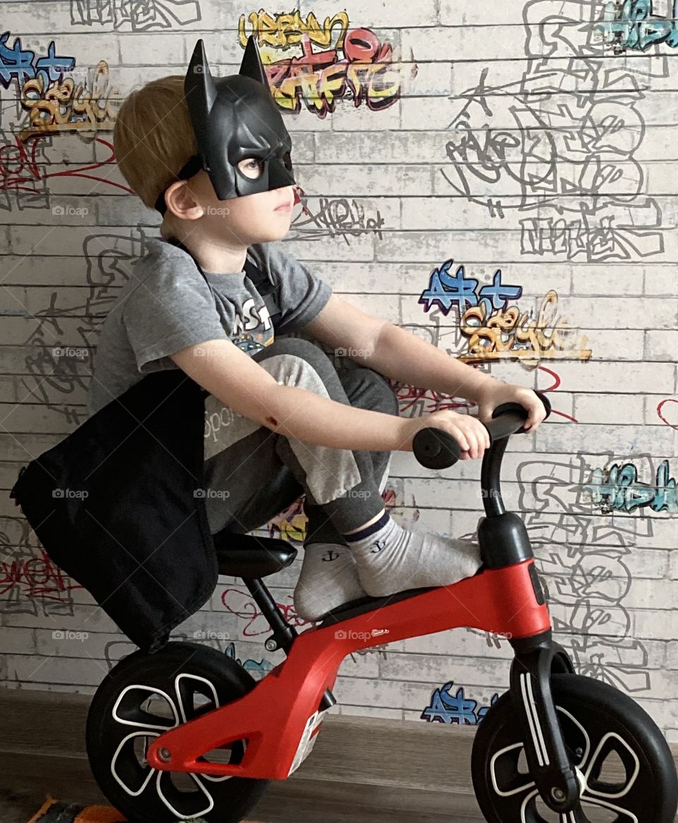  Little Batman-boy on a bicycle