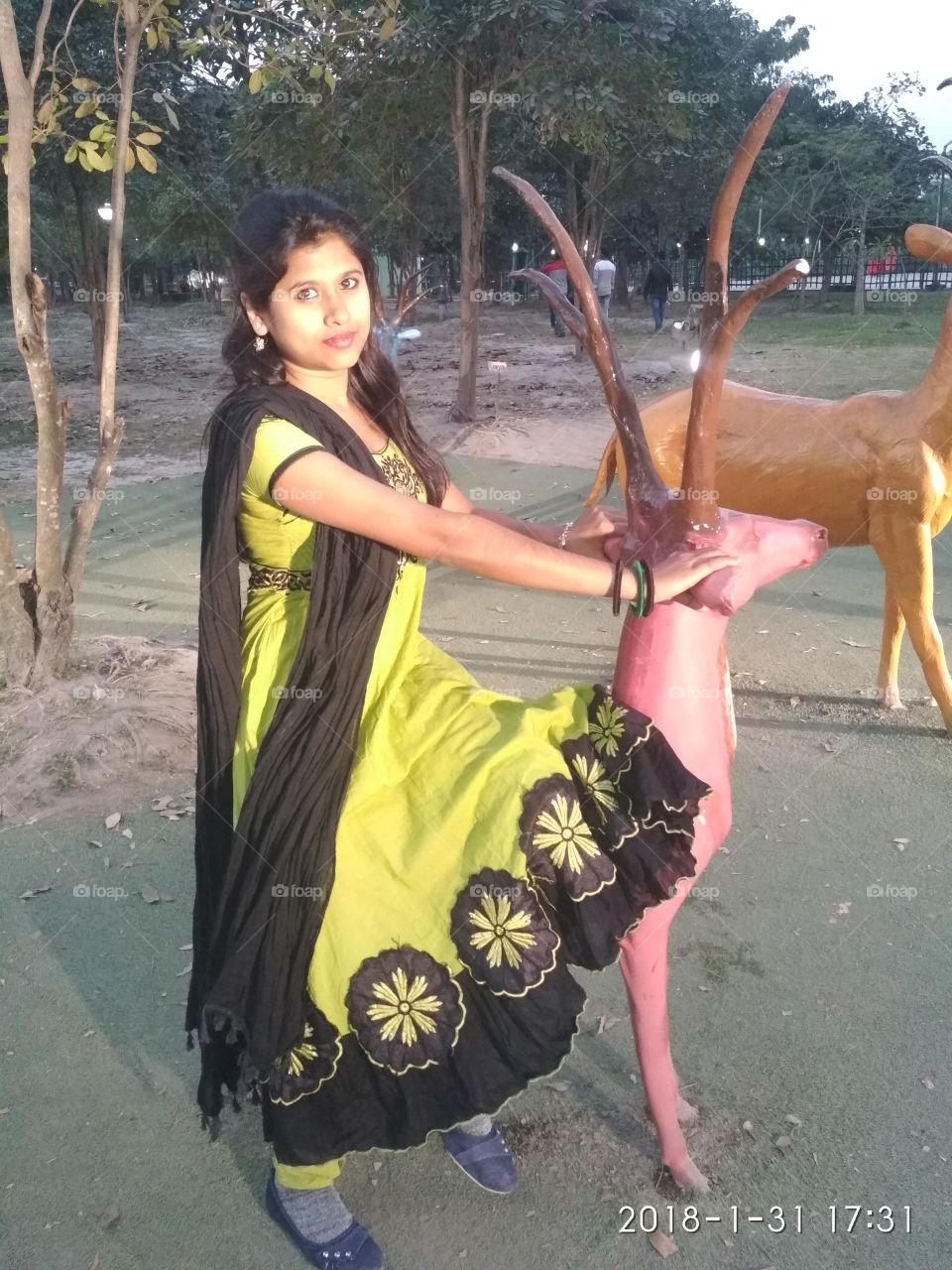 A beautiful lady ride on a animal at Eco-park