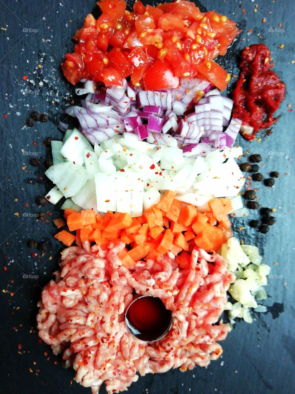 Raw ingredients for a meat sauce