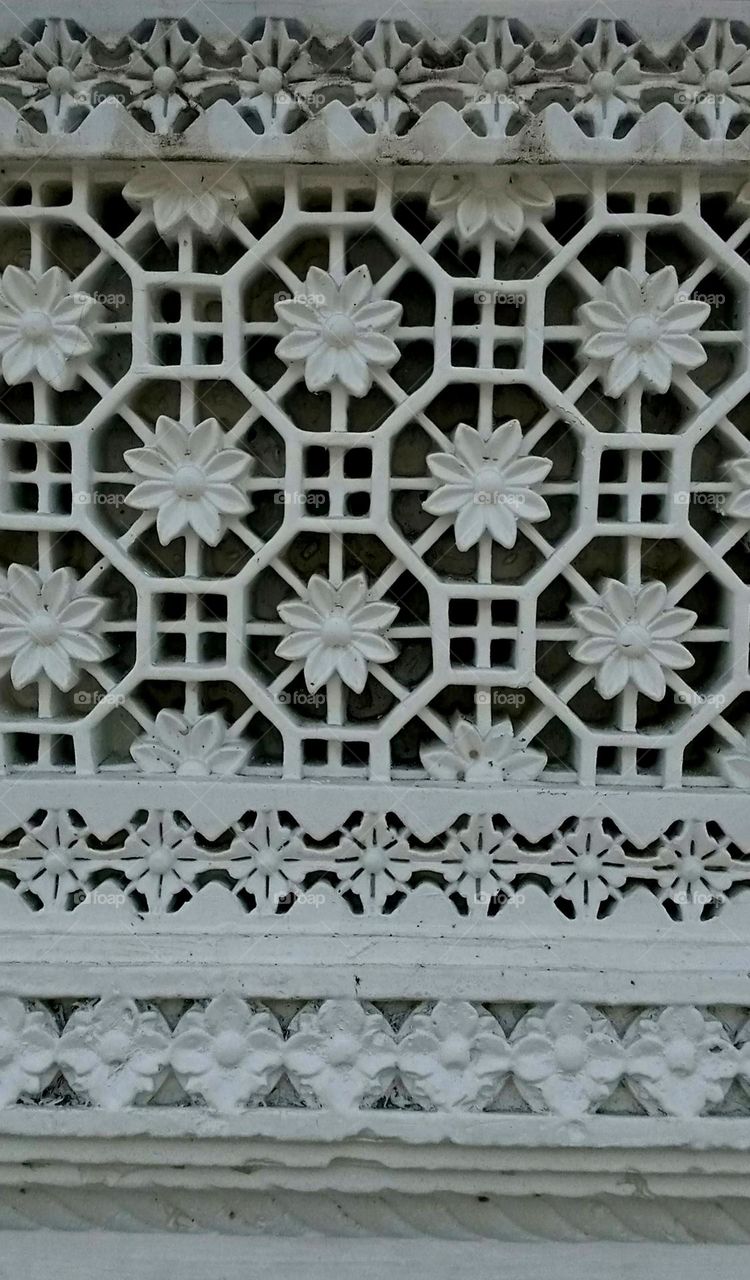 its a plaster of Paris work nice jall effect creat it's a holy place work white colour looks nice