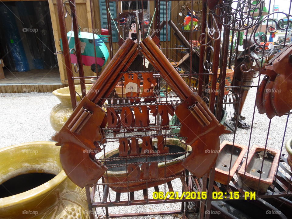 we don't dial 911 picture 2. This is a picture of a sign displayed in front of a gift shop in Mineral Wells Texas