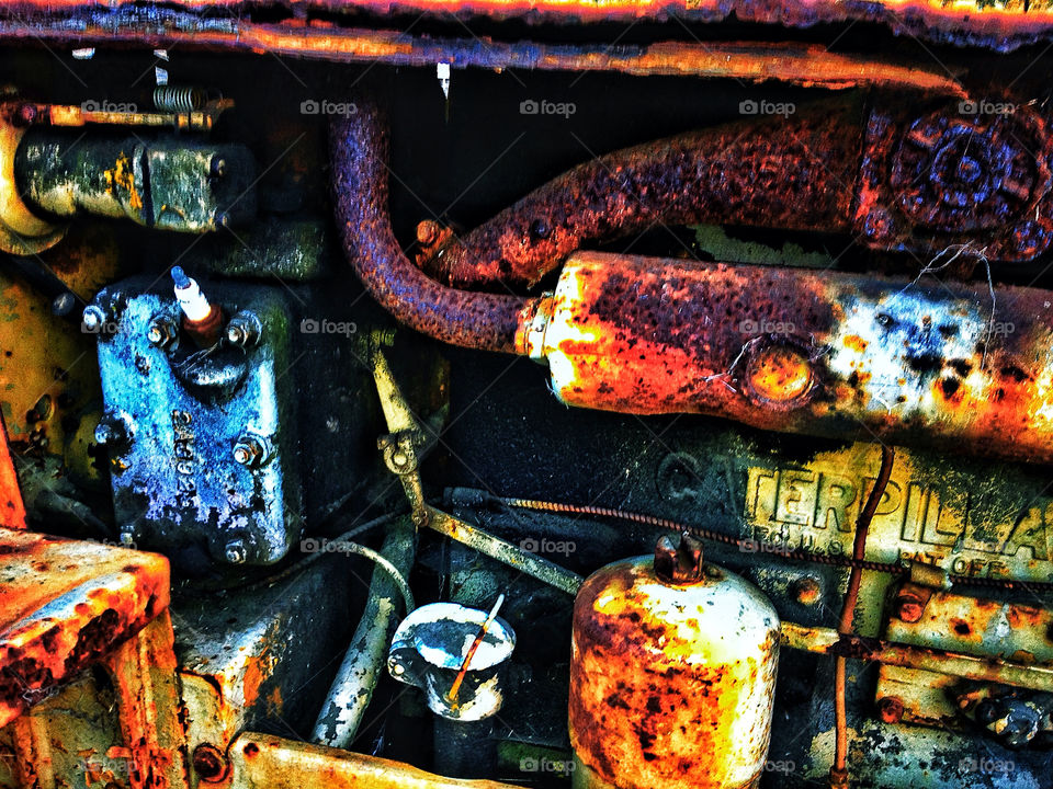 rusty metal pipes and components of antique American 1930s farm