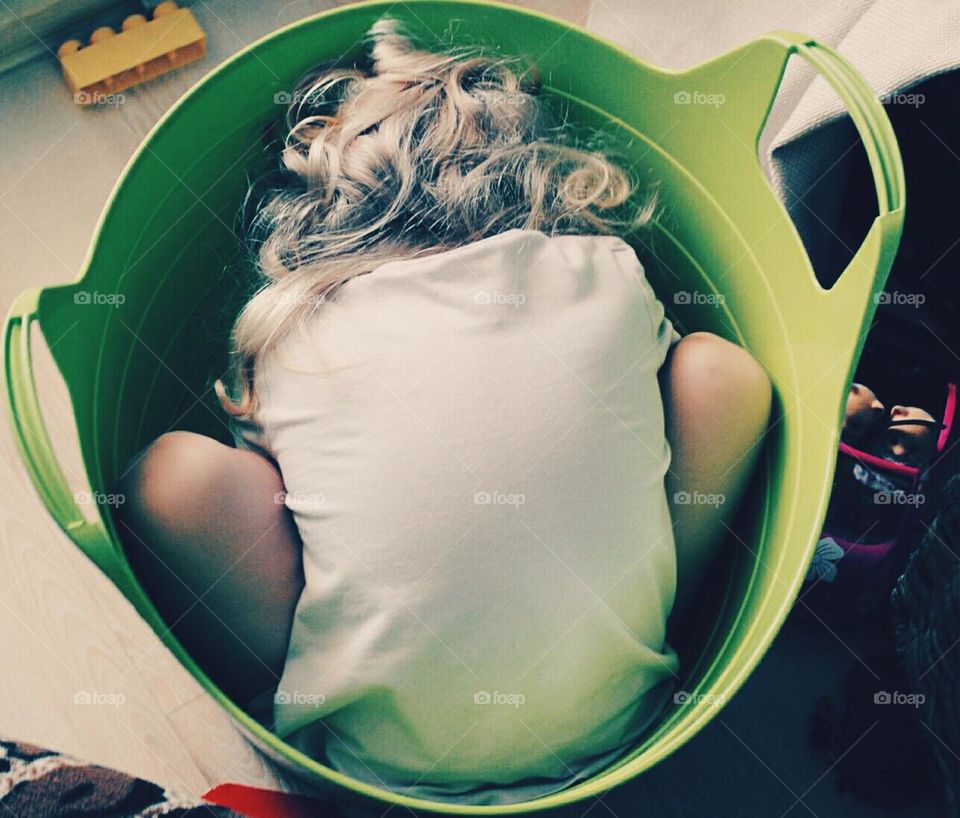 Hiding in the green basket. One day- one more fun