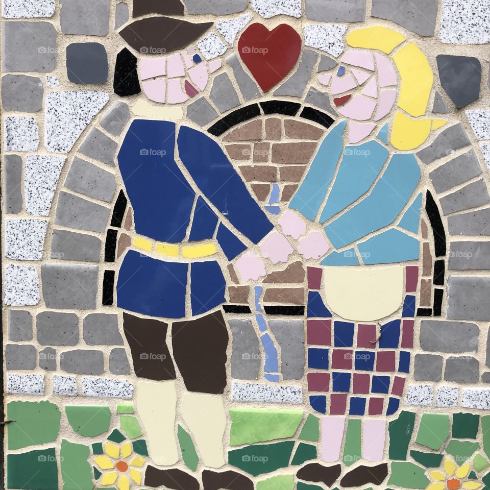 A lovely display via a mosaic of perhaps a couple in love with each other.