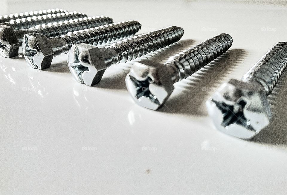 Subject metal by foaр missions,pictured metal screws on a white background