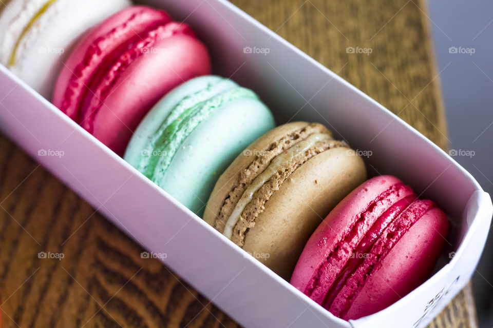 colorful macaroons on the wooden table