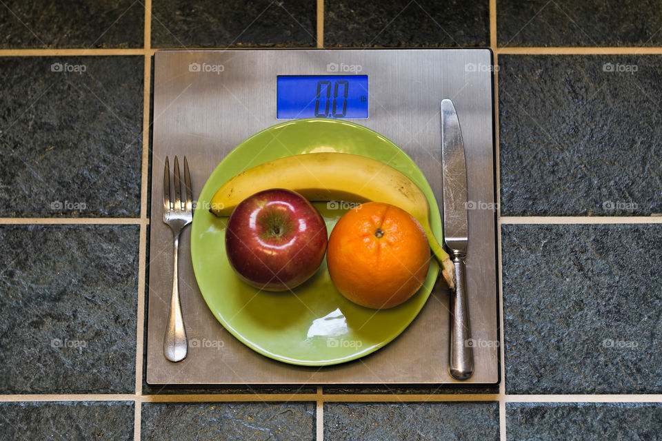 Fruit on plate on scale
