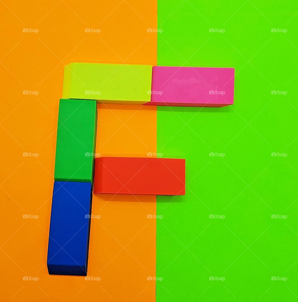 Rectangles in many colors spelling out the letter F