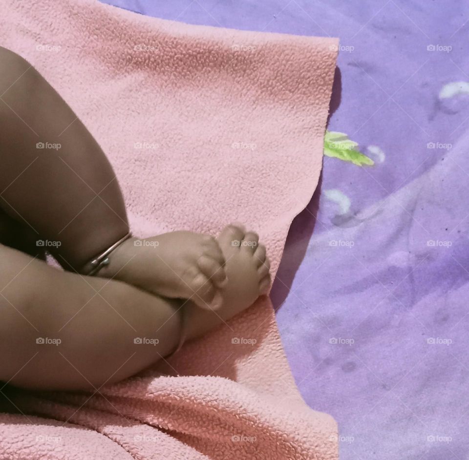 This beautiful β€οΈπ legs of two months baby girl π₯π. Baby is sleeping in her bed and playing joyfully with her toys!!πͺπ§Έ