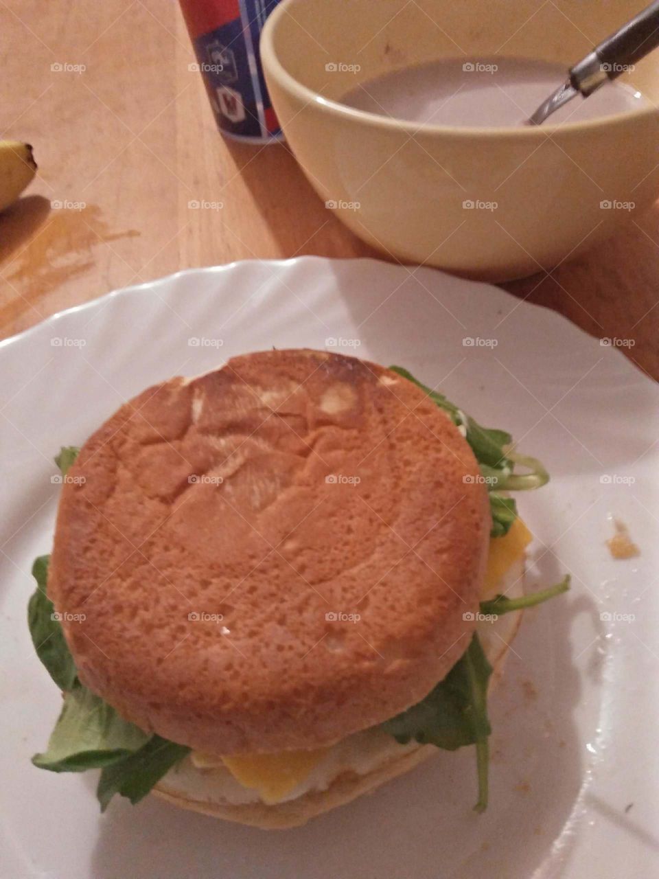 homemade burger with egg, cheese and jerjer leaves