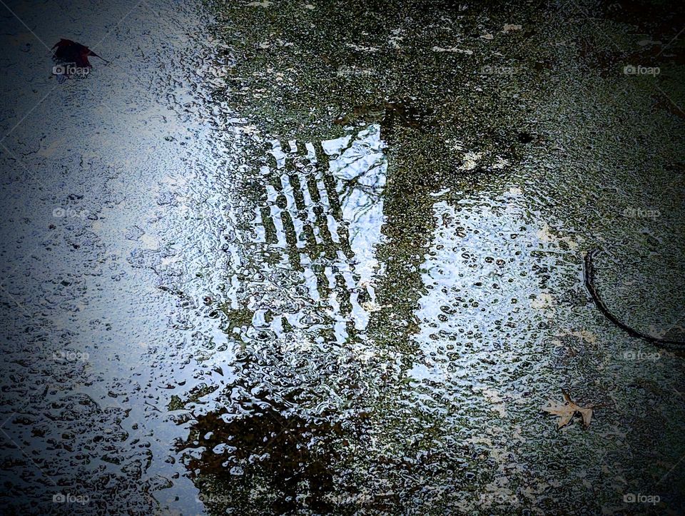 Rainy day photo of the back patio with peeling paint and some shadow interest.