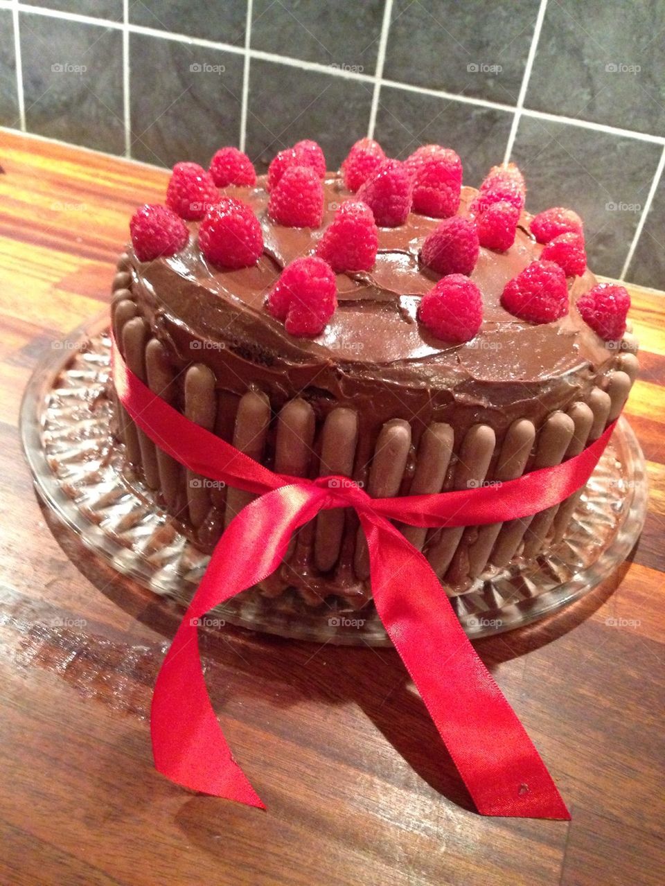 Birthday chocolate cake with raspberries 