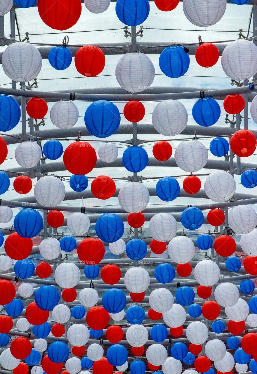 red, white and blue paper lanterns. Hung to celebrate the Queen's Platinum jubilee.