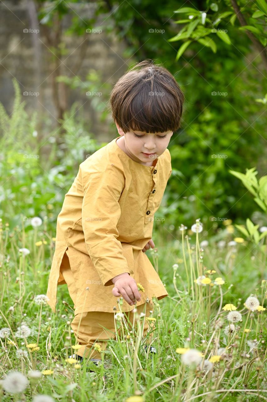 Cute kid feeling happy in beautiful spring season 
