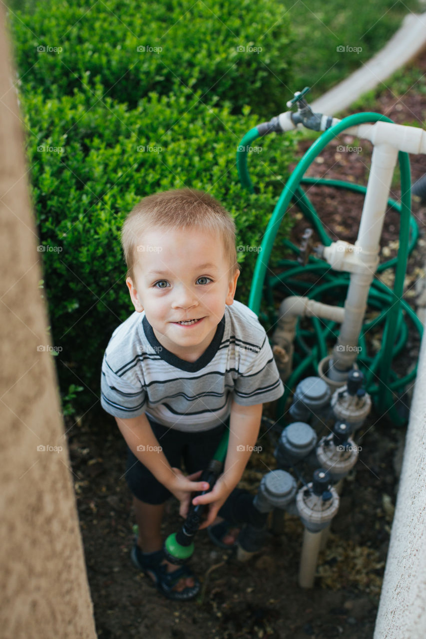 Toddler boy in the garden 