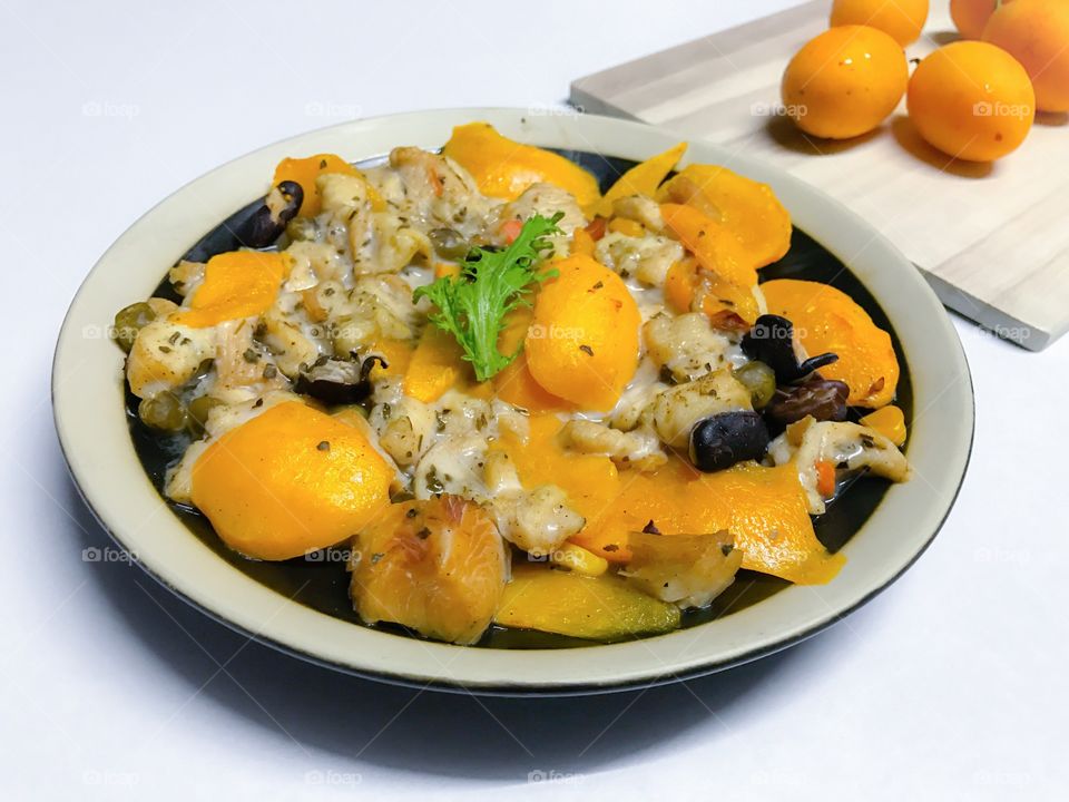 Steamed chicken breast with ripe sweet Thai Marian plum or plango (plum mango)