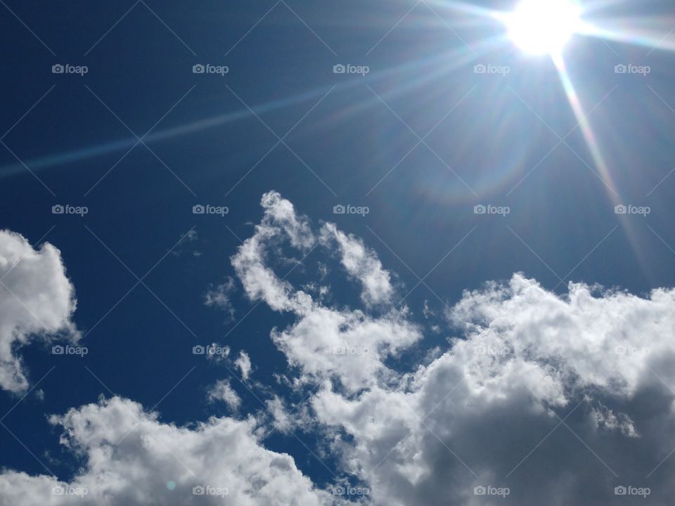 Sun shining thru clouds