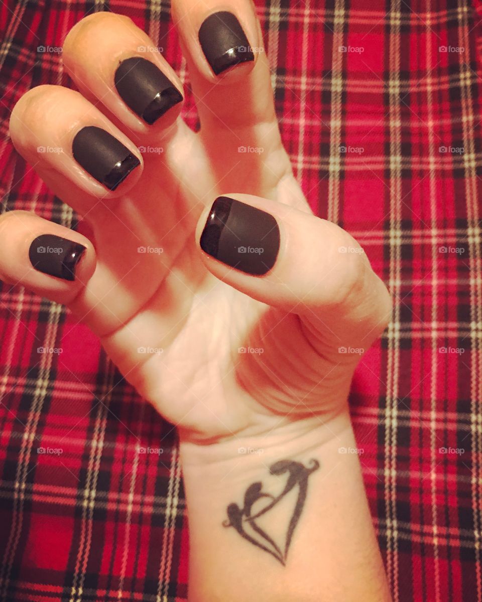 Black nails. Family tattoo 