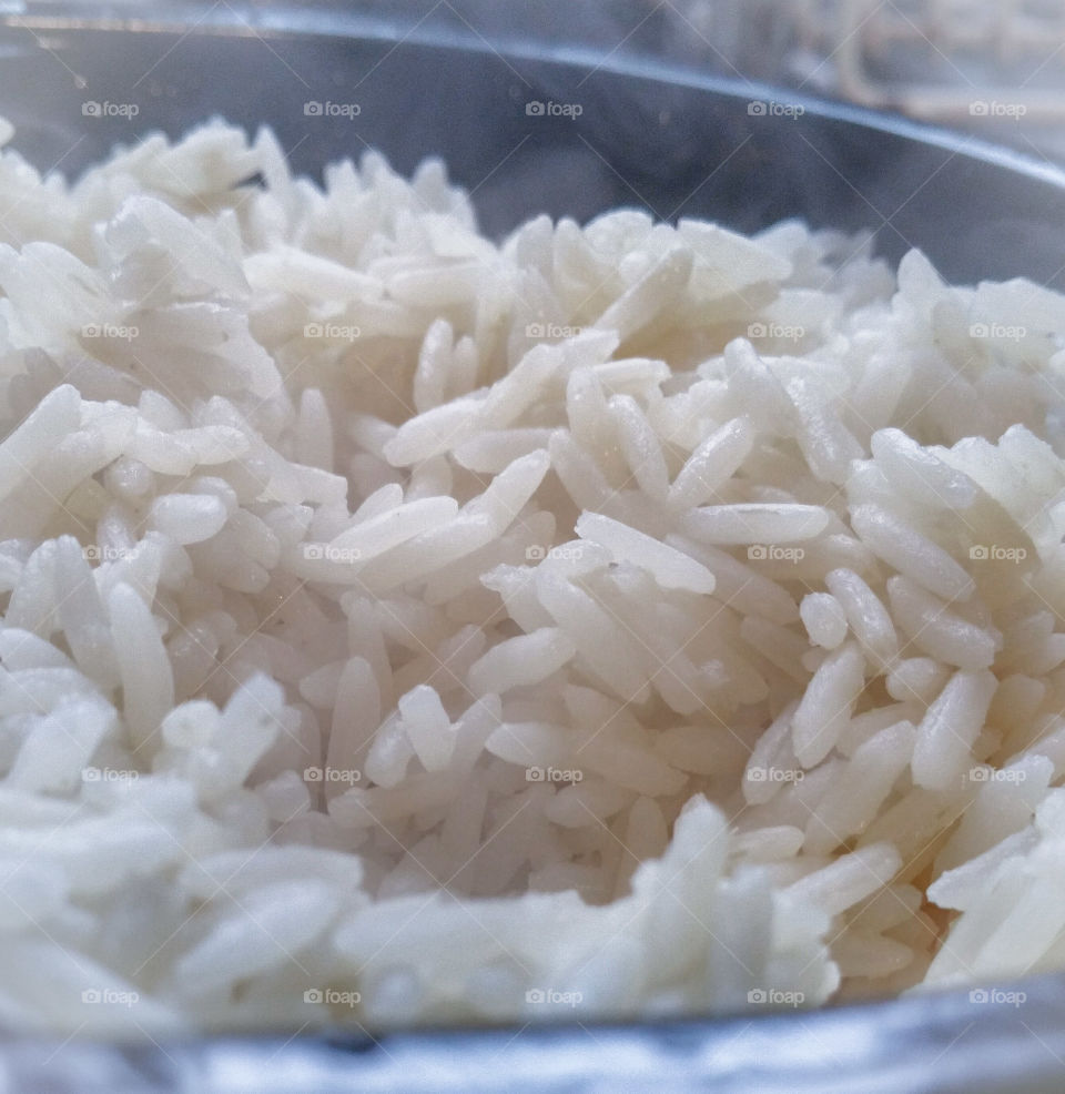 Steaming freshly cooked white rice