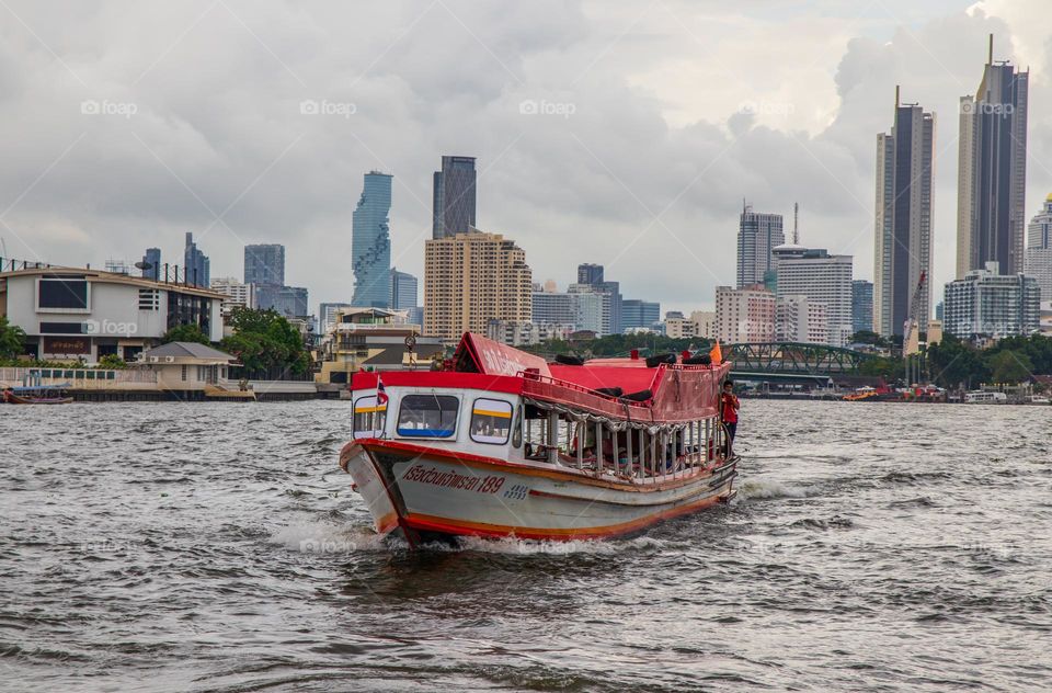 an express or taxi boat at the Chao Phraya River in the Capital City Bangkok Thailand Southeast Asia