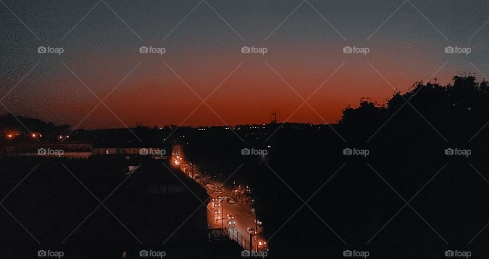 Rome's beating heart painted by sunset, blue and red melting onto a living city. Rome Italy.