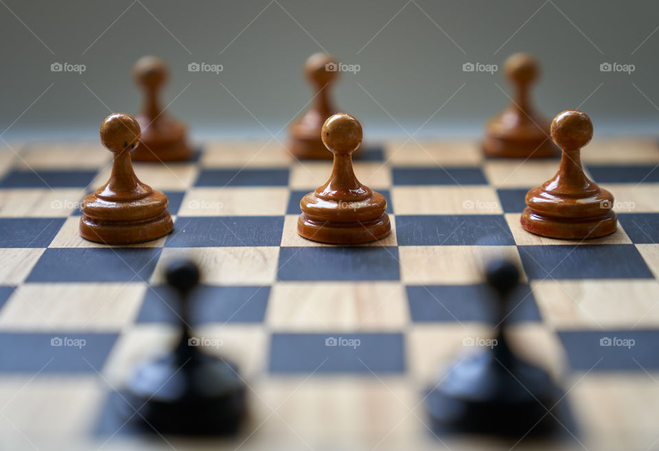 Concept chess pieces expressing social distancing.