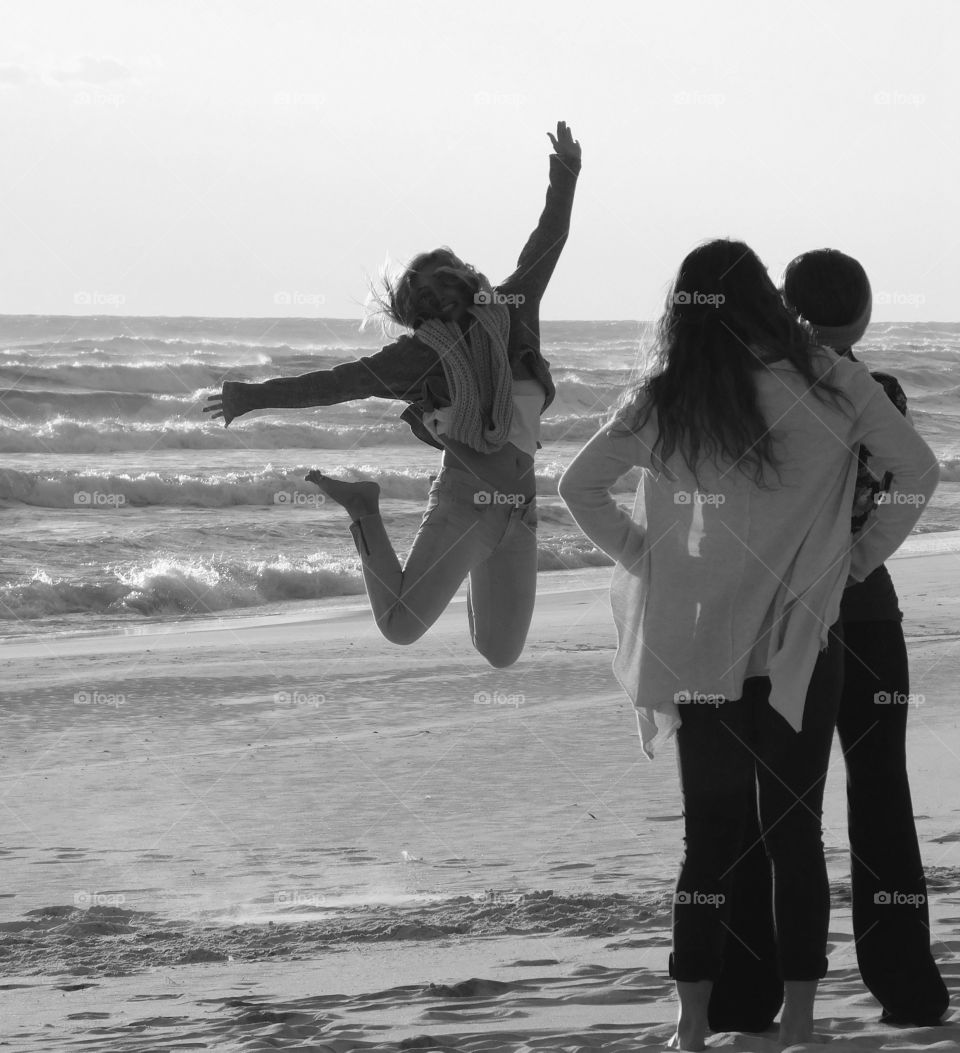 Jumping for joy on the sandy beach by the Gulf of Mexico!
A family from New England enjoying the warm breeze and sandy beach!