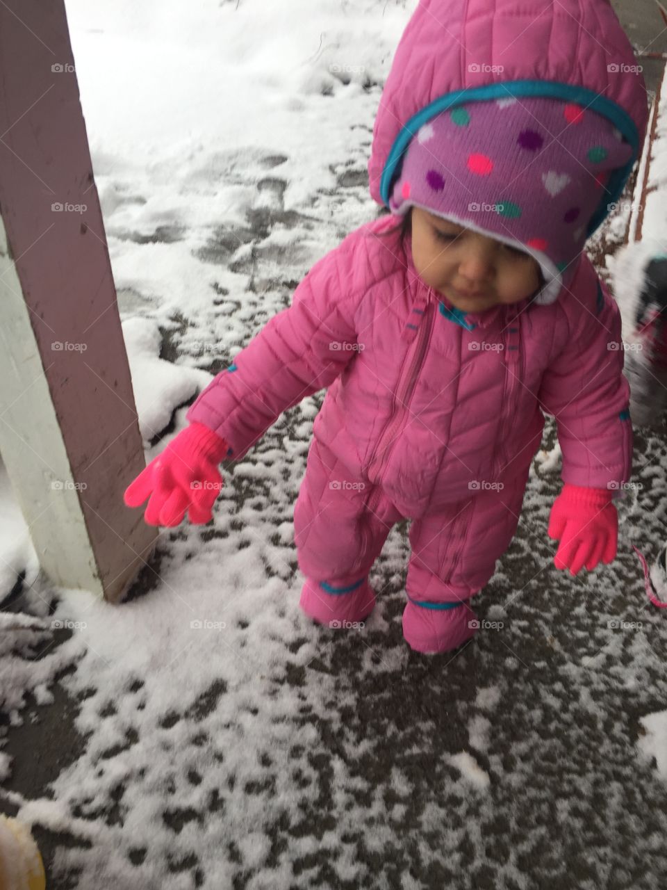 Baby playing in the snow