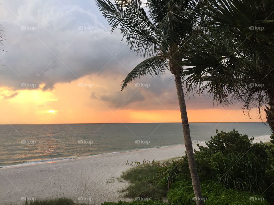 Rainy beach sunset 