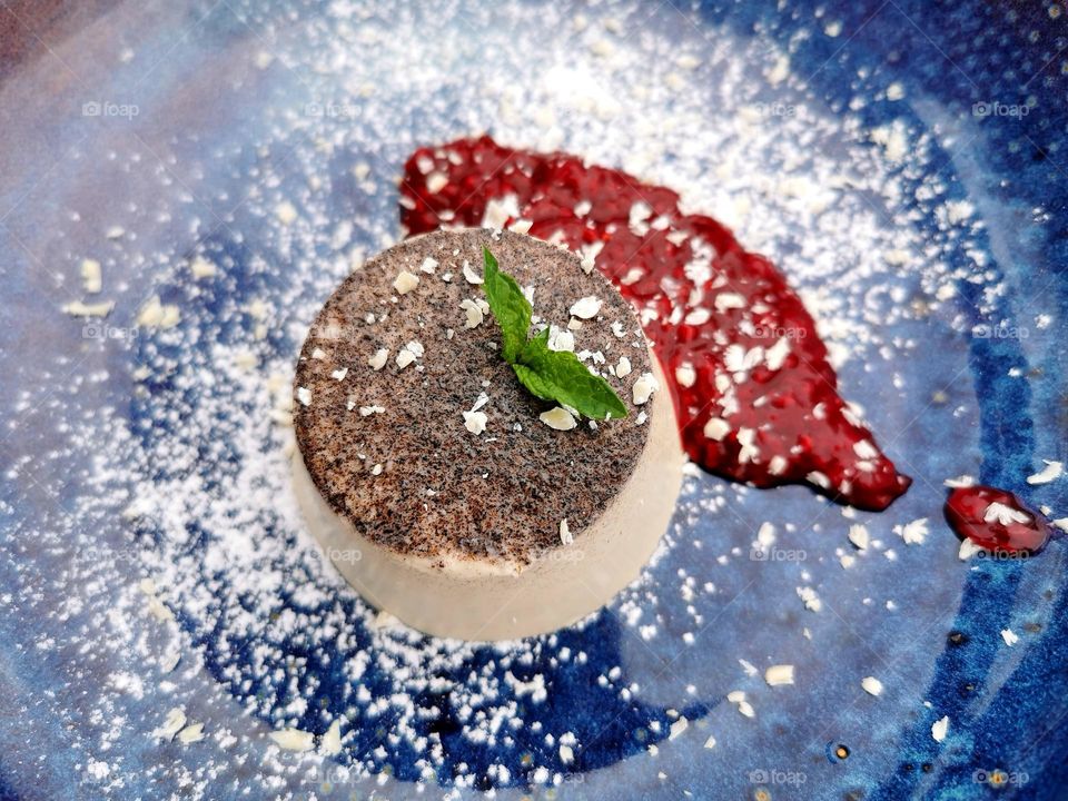 Pannacotta on blue plate