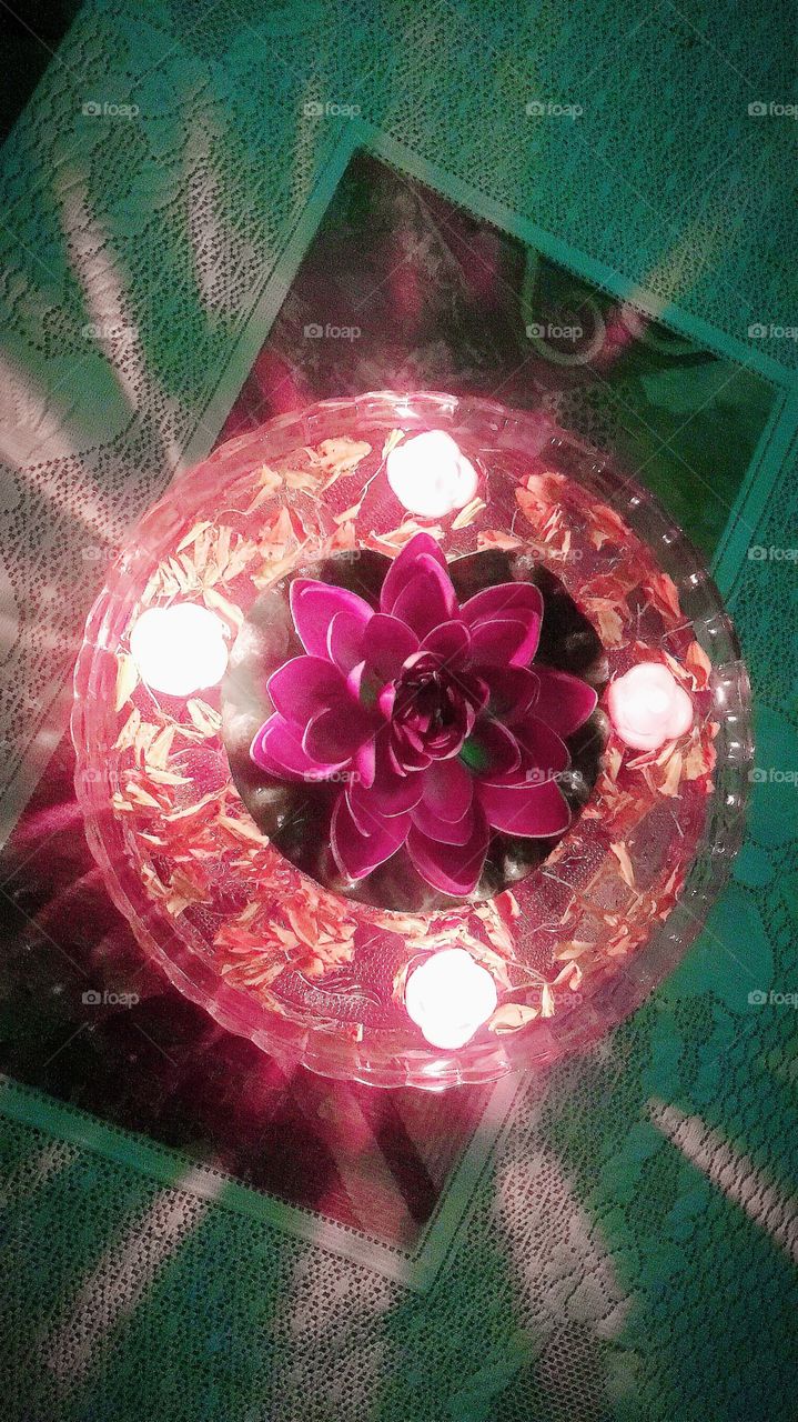 A floating candle decoration.A floating candle is a candle that when placed in water it floats.This is the traditional way to light and It also help to refresh our mind and soul.