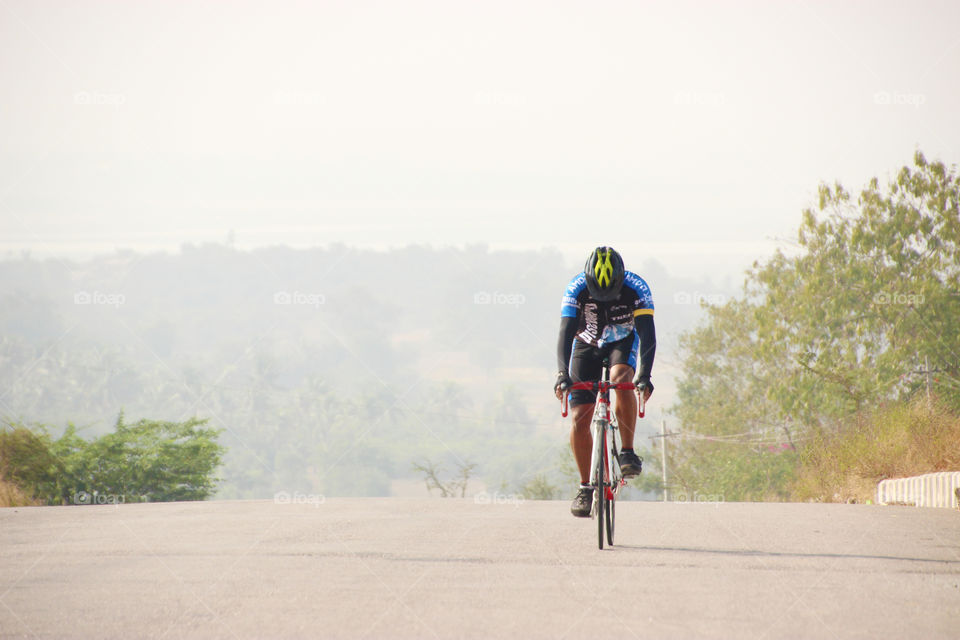 Cyclists in blue wears, cycling