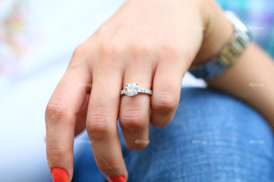 Engagement ring. Beautiful huge diamond engagement ring in the hand of a beautiful bride to be 