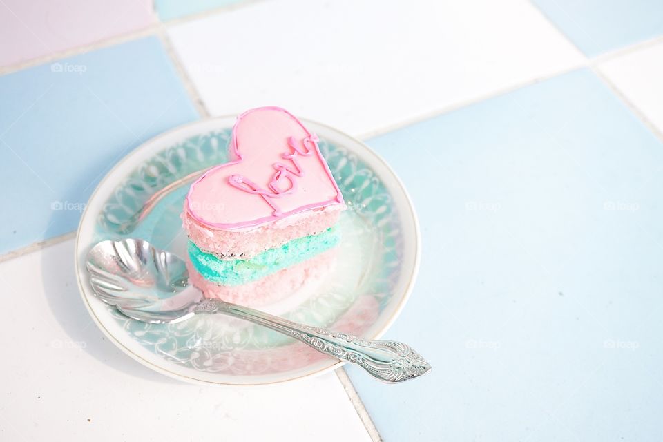 Valentine's cake. A pink heart cake with love message on the cake. Love and romantic concept.