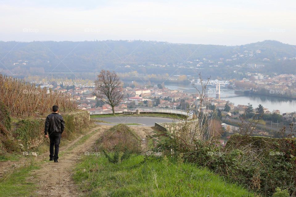 Faceless man hiking alone in the mountains in Europe 