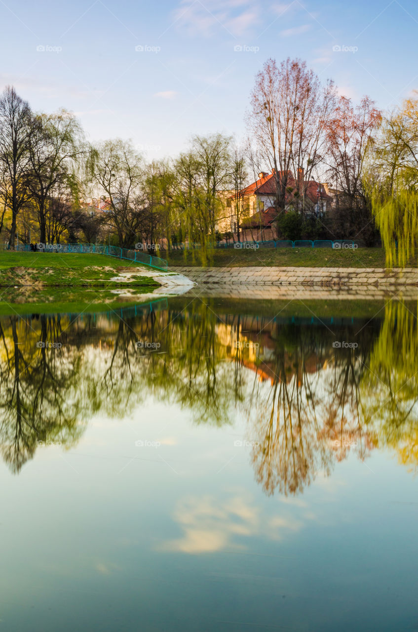 city park with lake in the spring season