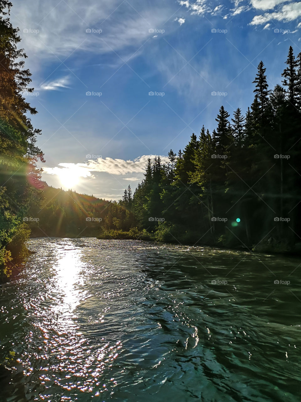 sunrise on a mountain river in the forest