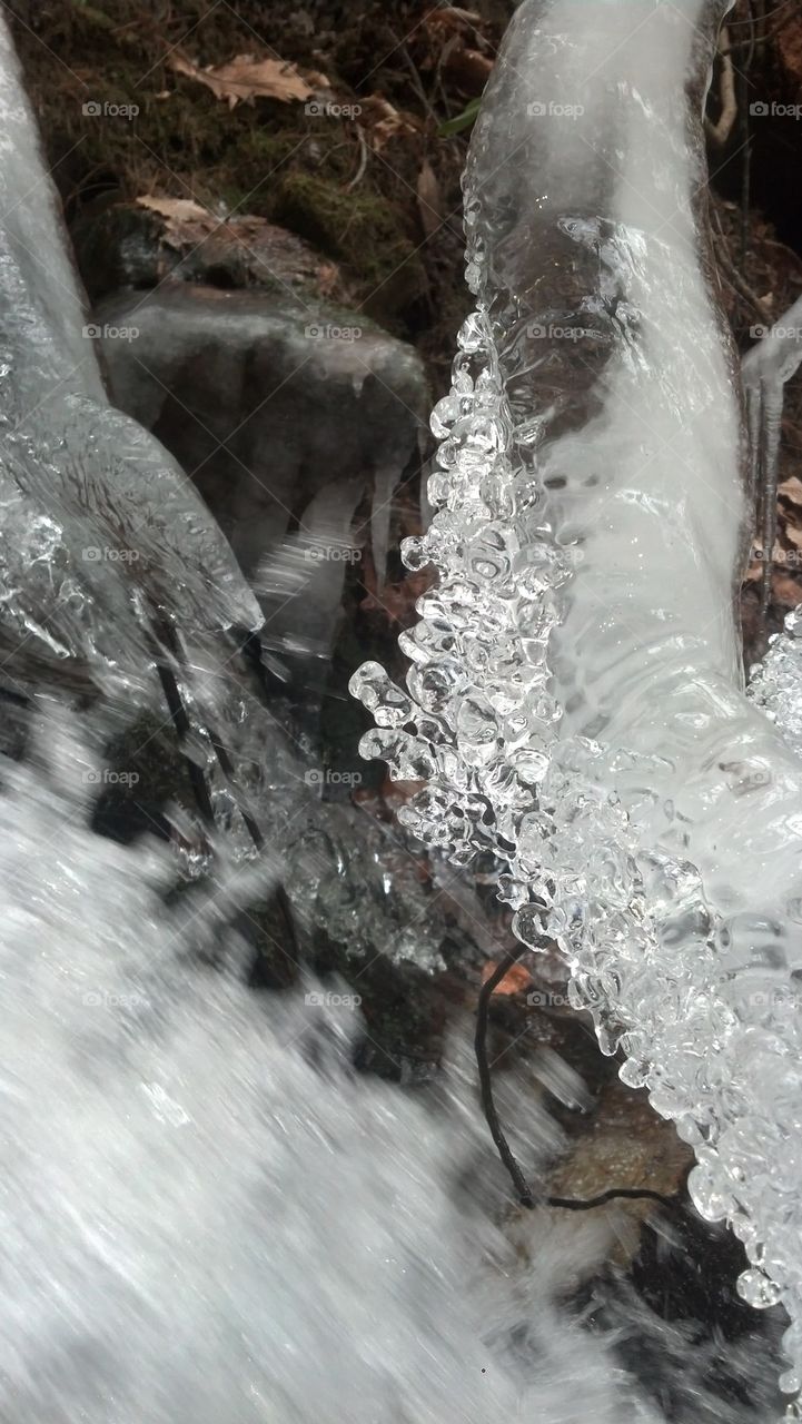 Frozen waterfall spray