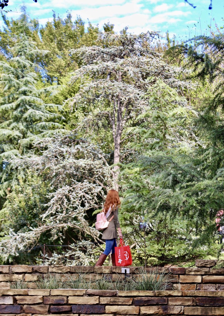 Walking all alone with no one around, just me and the trees.