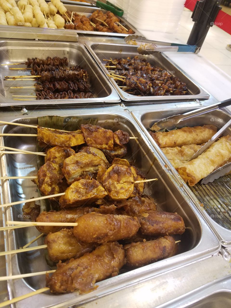 fried sweet potatoes  with brown sugar in a stick