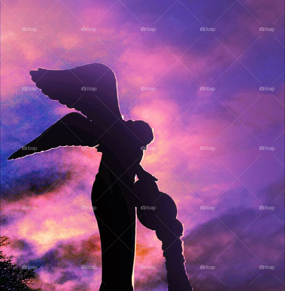 Angel in the sky. I took this pic in New Jersey of a statue of an angel