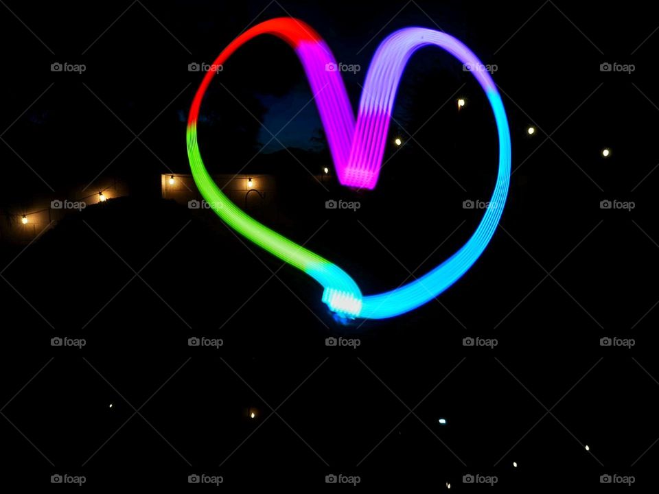 A long exposure photo with a light cube creates a message of love and the need for togetherness